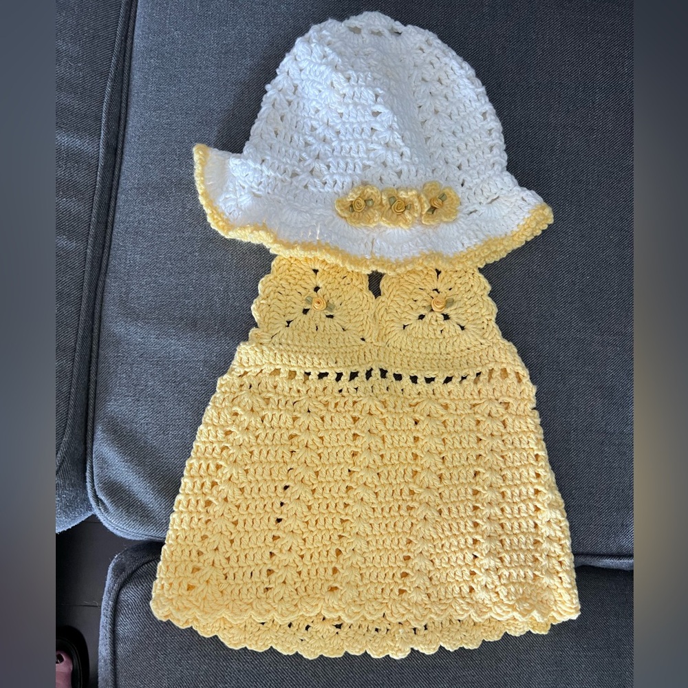 Handmade Bright Yellow and White Crochet Dress and Hat Set with yellow flowers.